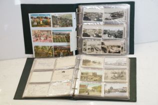 Collection of early 20th century postcards contained within two albums, mostly depicting Queensland,