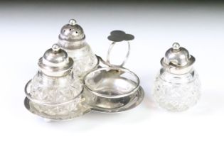 A fully hallmarked sterling silver & cut glass cruet set in the form of a three leaf clover, assay