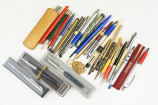 A collection of vintage and contemporary pens and pencils to include gold nibbed fountain pen and