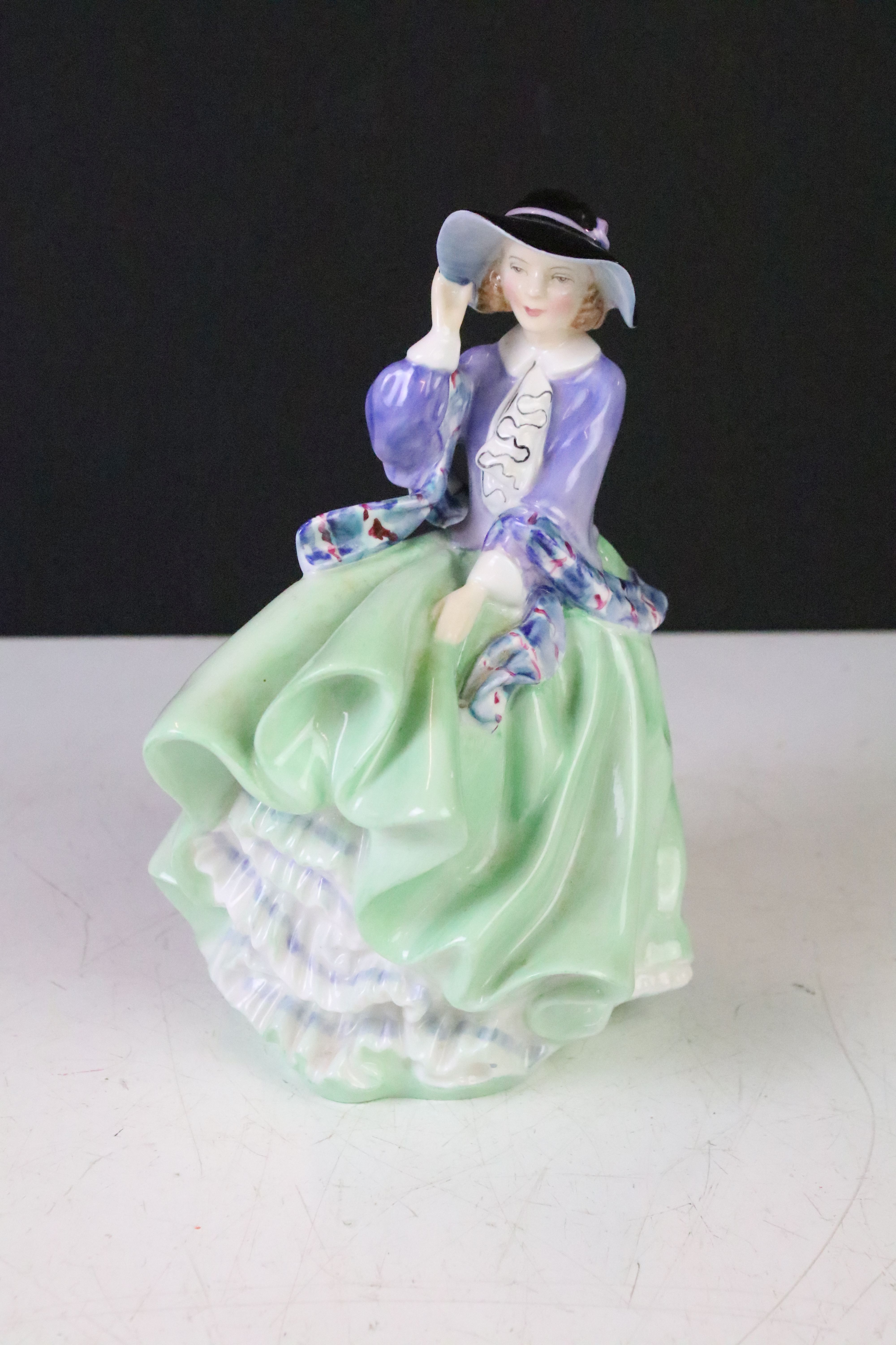 Four Royal Doulton porcelain figurines to include The Old Balloon Seller (HN1315), Autumn Breeze (HN - Image 17 of 18