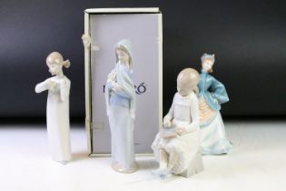 Group of Lladro figurines to include two figurines of girls, one of a lady holding lilys (boxed) and