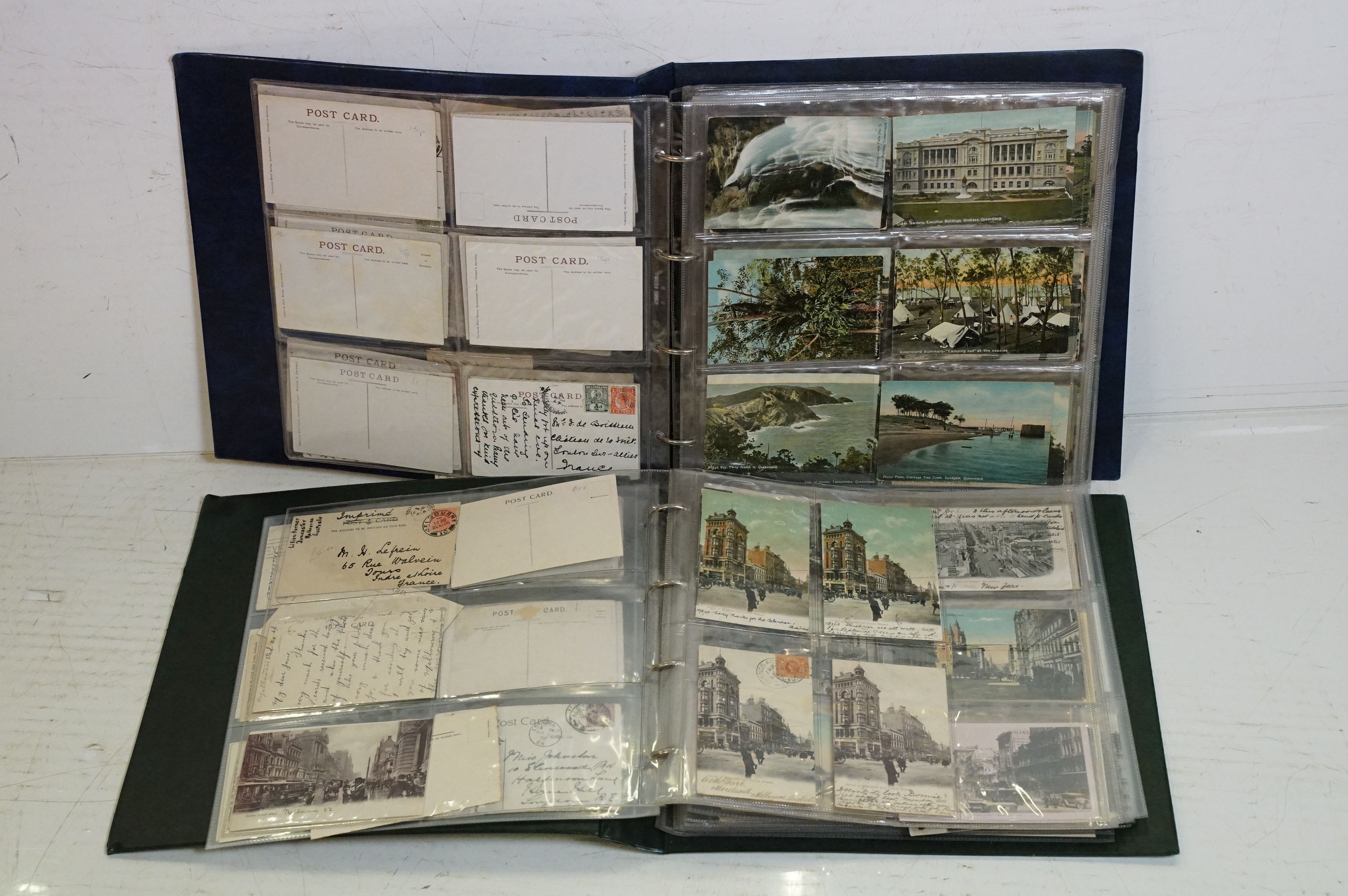 Collection of early 20th century Australian / Australian-themed postcards contained within two