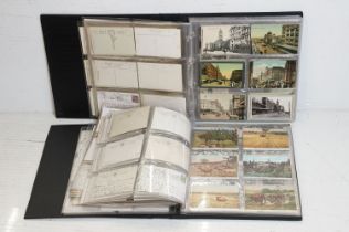 Two albums of early 20th century Australian postcards, in monochrome & colour, to include a large