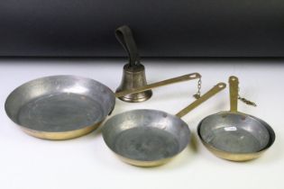 Graduating set of four brass frying pans (largest diameter approx 23cm), together with a brass