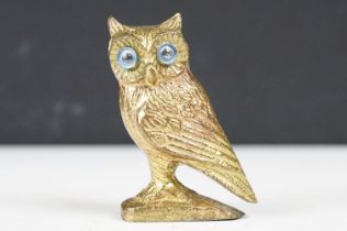 Brass Model of a Brass Owl with blue glass eyes, 6cm high