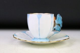Aynsley Art Deco tea cup and saucer having a butterfly formed handle, gilt rims and blue hand