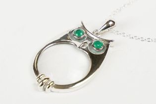 Silver Magnifying Pendant Necklace in the form of an Owl with Emerald Eyes