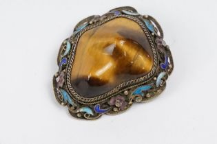 A vintage 925 sterling silver ladies brooch set with large central tigers eye and surround by