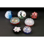 Seven glass paperweights to include Caithness & Langham examples, featuring Caithness Peach Floral