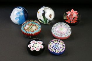 Seven glass paperweights to include Caithness & Langham examples, featuring Caithness Peach Floral