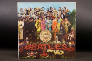 Vinyl - The Beatles Sgt Pepper's Lonely Hearts Club Band LP on Parlophone Records PMC 7027. Original