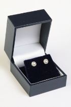 Pair of 14ct white gold diamond stud earrings