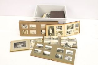 A collection of vintage photograph albums complete with contents and together with loose examples to