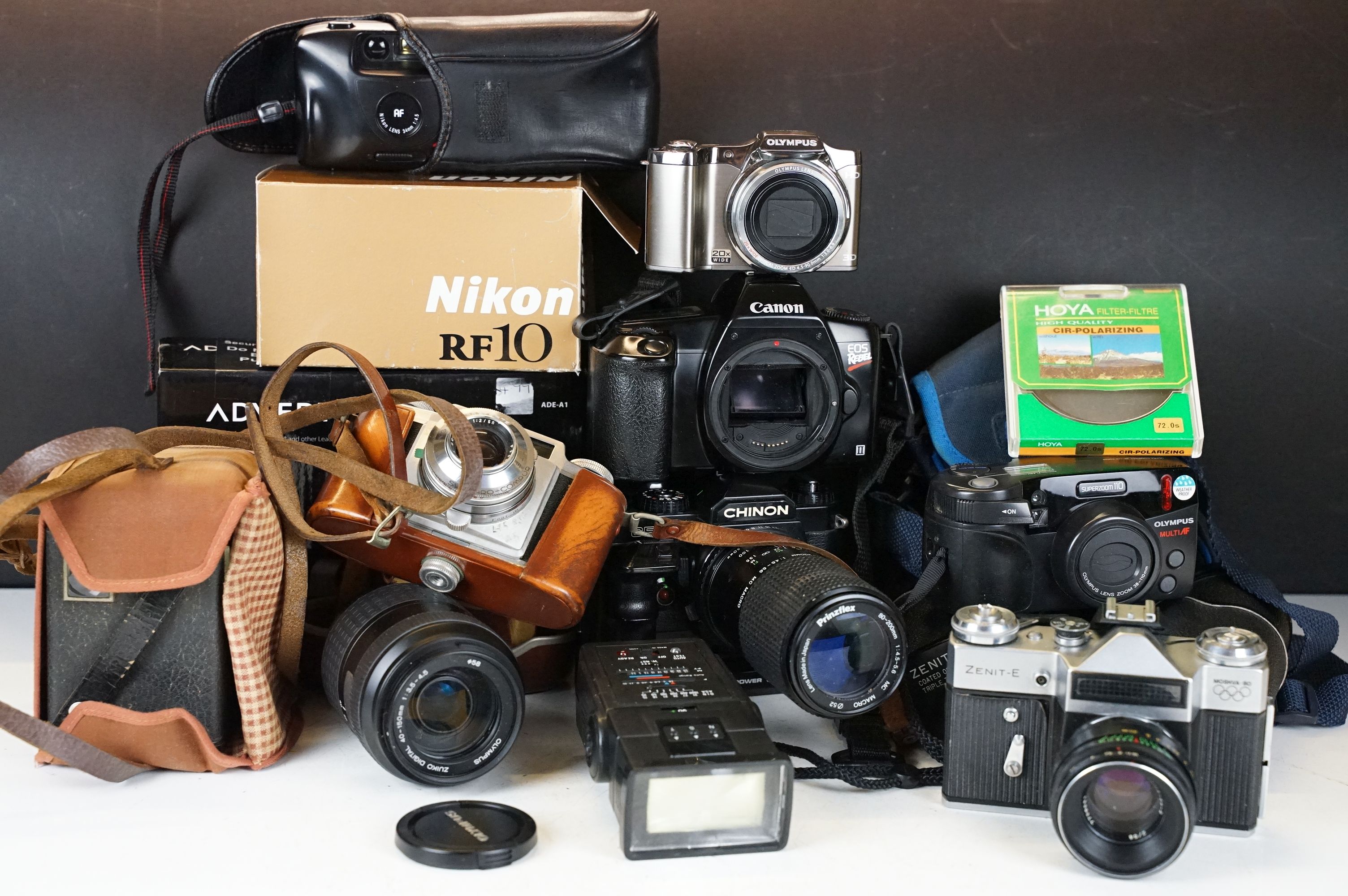 A collection of mixed photographic equipment to include Zenit and Chinon 35mm SLR cameras together