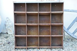 Weathered metal cabinet with 16 pigeon holes, approx 90cm H x 91cm W