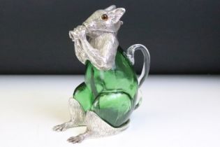 Unusual silver plated squirrel decanter in green glass