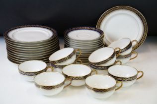 20th Century vintage Limoges tea service having a white ground with navy blue and gilt rims. Green