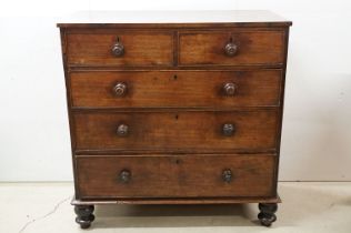 Victorian mahogany chest of two short and three long drawers, with turned handles on turned bun