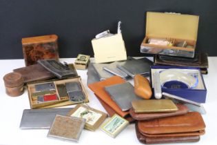 A group of smoking related collectables to include cigarette cases, leather cigar cases, lighters,