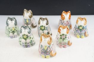 Collection of eight porcelain cat figures from original designs by Joan de Bethel, depicting cats