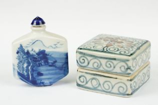 A Chinese blue and white ceramic trinket box with traditional blue and white decoration together