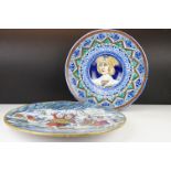 Two Italian faience wall plates, one depicting Roman figures with a volcano beyond, the other with a