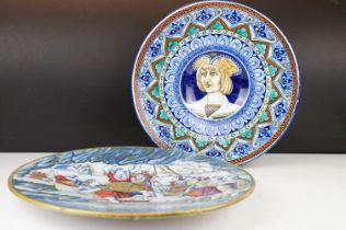 Two Italian faience wall plates, one depicting Roman figures with a volcano beyond, the other with a