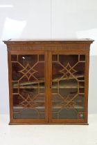 20th century mahogany astragal glazed two door display cabinet fitted with three shelves,