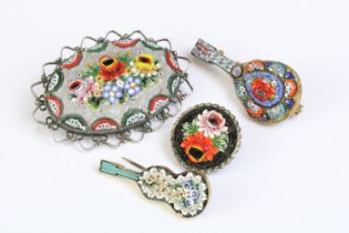 A collection of four micro mosaic brooches to include two in the form of musical instruments