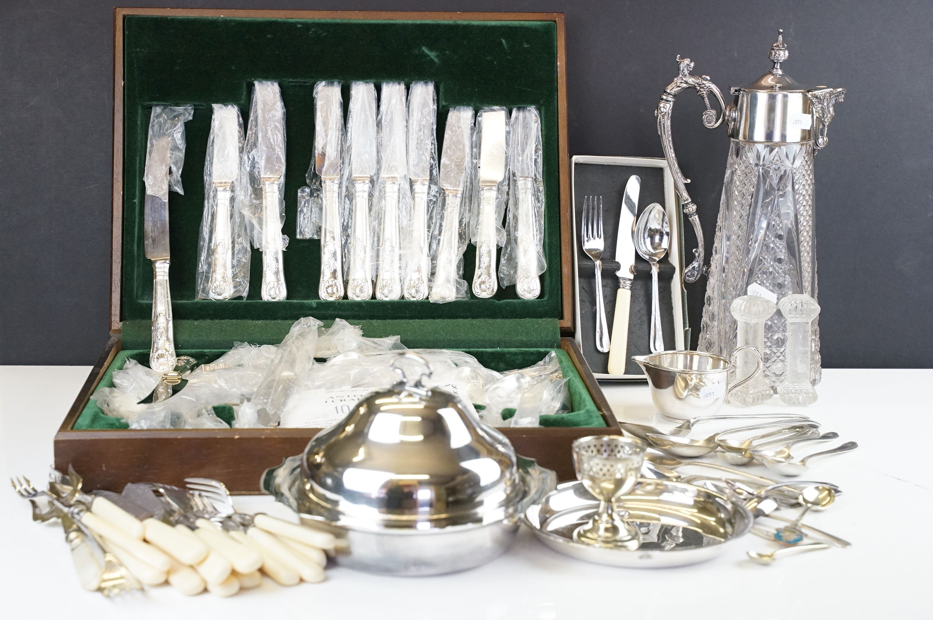 A canteen of silver plated cutlery within original packaging, together with a quantity of mixed...