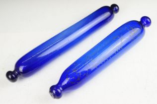 Two 19th century Bristol blue glass rolling pins, one with sailing themed detail & inscription,