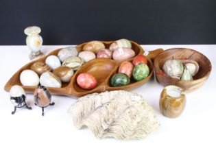 A large collection of polished stone eggs together with fruit examples
