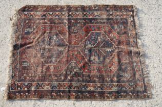 Middle Eastern red ground wool Rug decorated with two guls, 150cm x 118cm