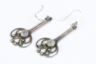 A pair of ladies 925 sterling silver drop earrings, in the art nouveau style each set with central