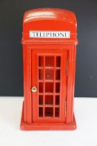 Holdcourt Ltd of London - A painted wooden model of a telephone box, makers label to reverse.