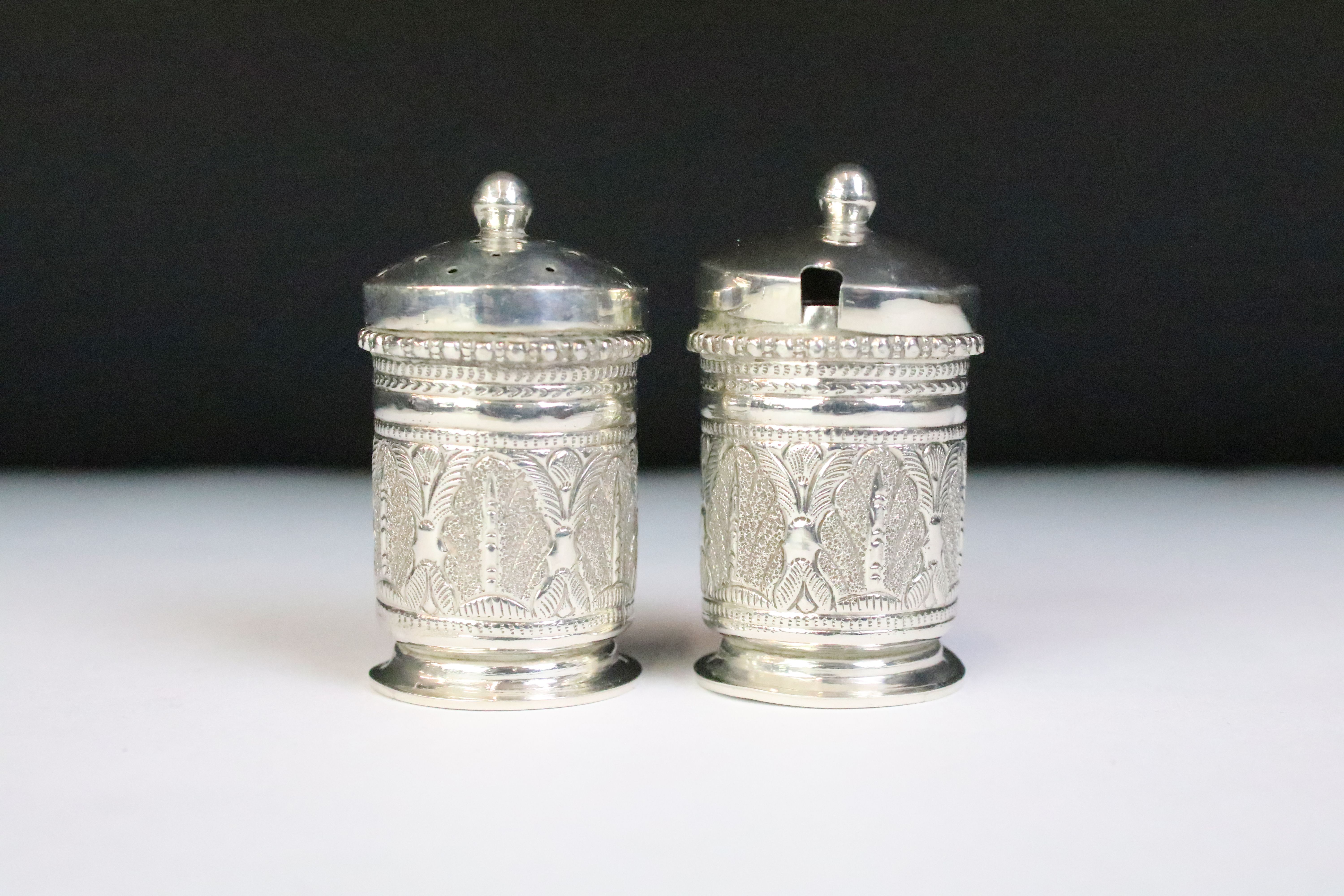 A white metal three piece cruet set with matching tray, complete with salt spoon. - Image 4 of 8