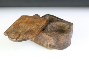 Indian carved wooden spice box with pivoting lid and twin compartment interior. Approx 20cm long
