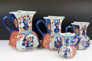 19th century set of four Ironstone China octagonal jugs decorated in the Imari palette, heights