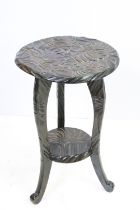 20th century hardwood two-tier occasional table, carved with floral design, 45cm high x 28cm