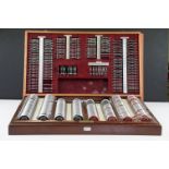 A vintage opticians eye testing kits within wooden cases.