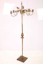 20th century gilt metal six-branch candle stand, modelled with leaves and flowers, 136cm high