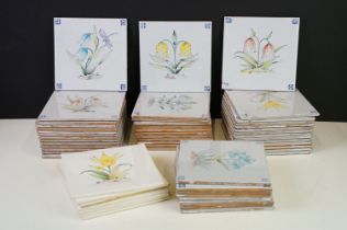 Collection of tin glazed wall tiles each decorated with floral sprays. 4 small boxes.