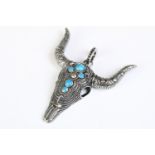 A large 925 sterling silver pendant in the form of a steer / bulls head skull, set with five