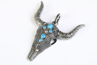 A large 925 sterling silver pendant in the form of a steer / bulls head skull, set with five