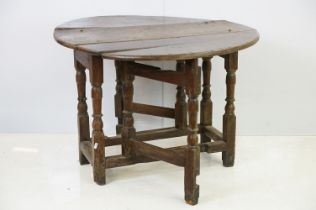 18th / 19th century oak drop leaf table of oval form on tuned legs, 6cm high x 97cm wide 89cm deep