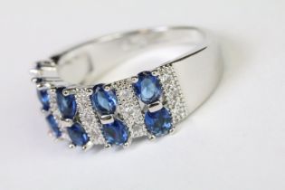 A 925 sterling silver ladies dress ring in the Art Deco style set with blue and clear stones, marked