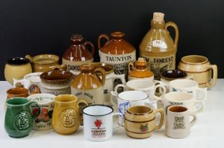 Collection of cider bottles and mugs to include the Taunton cider company, Matthew Clarke, Coombes