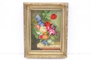 Ornate gilt framed oil painting of a Classical still life of flowers in an urn on a ledge, 41.5 x