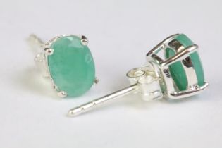 Pair of emerald stud earrings on silver posts