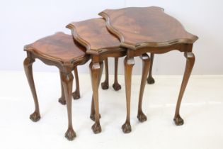 Nest of three mahogany tables on ball and claw feet, the largest - 51cm high x 55cm wide x 41cm deep